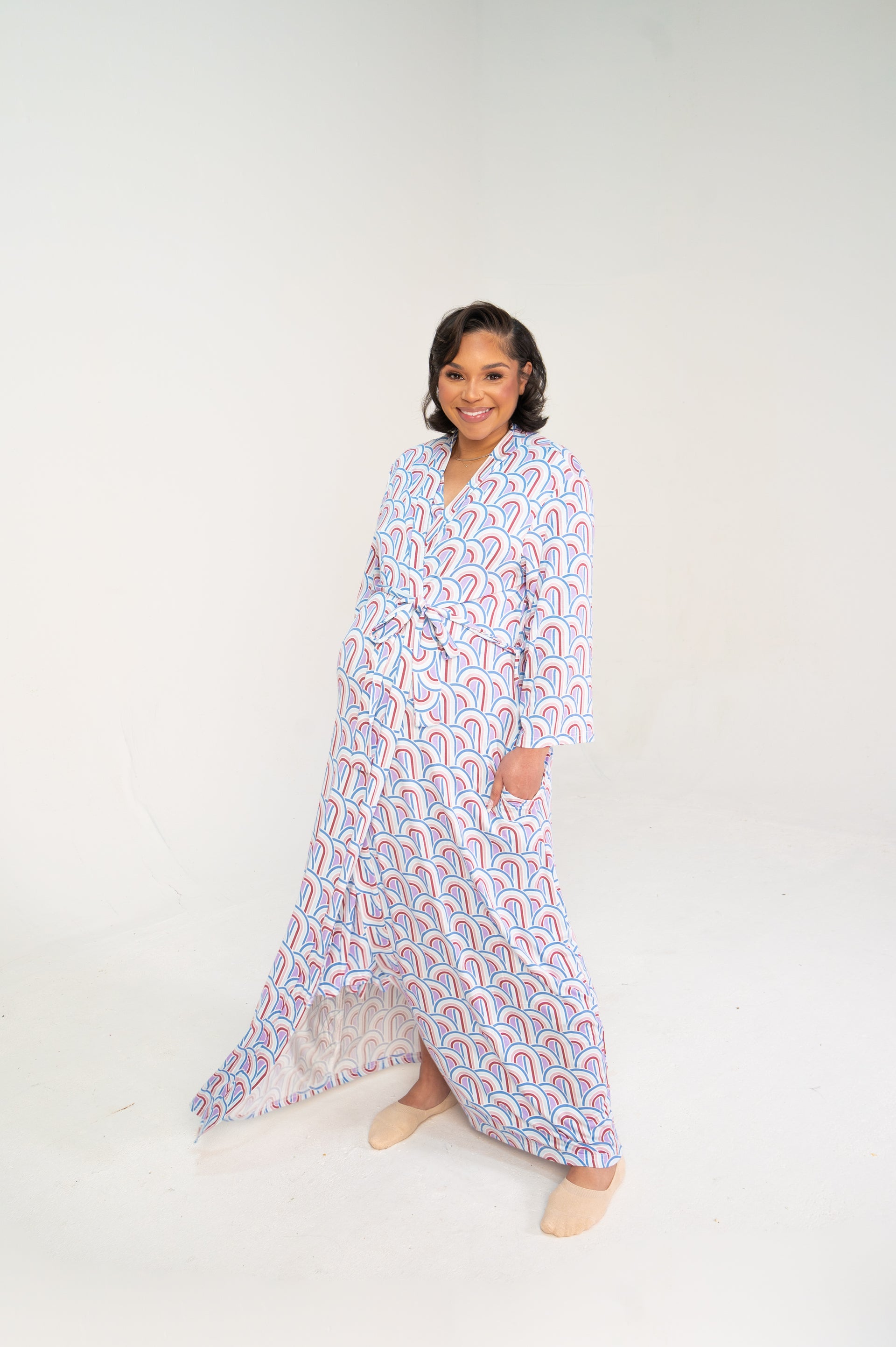 woman standing in rainbow maternity robe