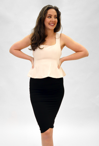 model in a tan maternity top
